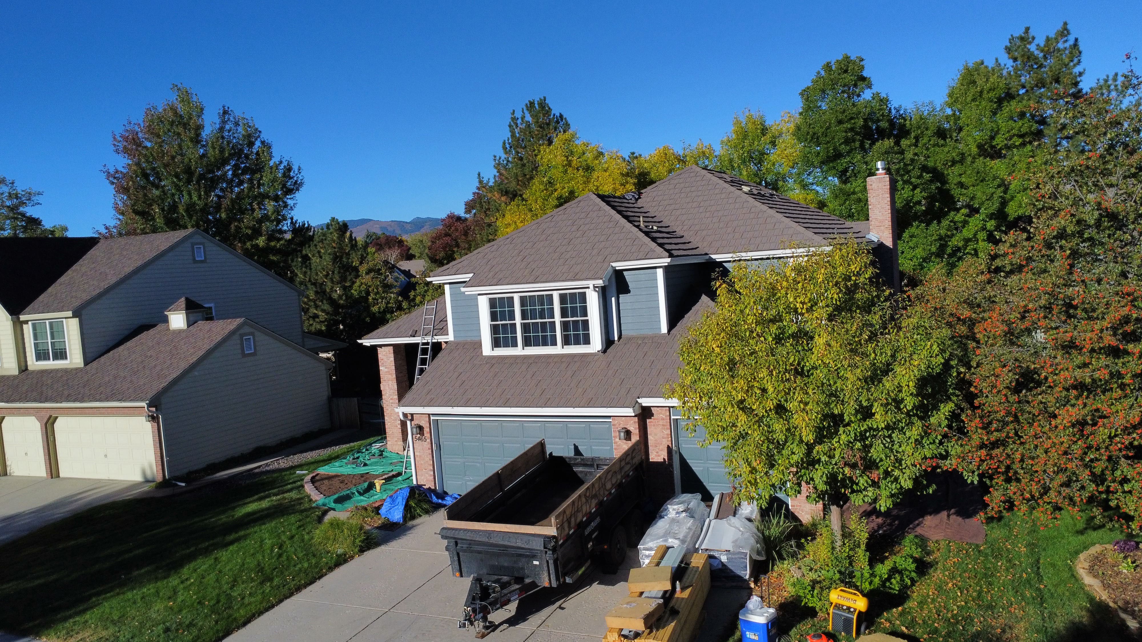 Roofing crew working on a residential property
